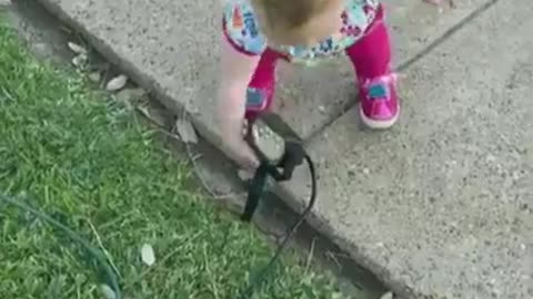 Adorable baby thinks everything is a hand sanitizing station