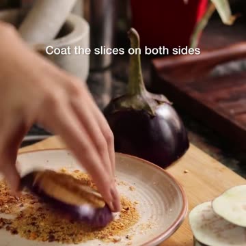 "Sizzling and Spice: Unveiling the Seared Delights of Tawa Baingan"