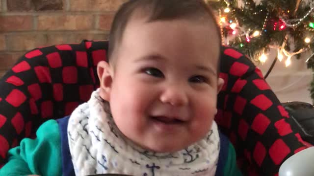 Adorable baby having fun on his new walker