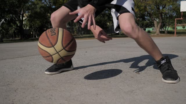 Basketball player dribbling ball