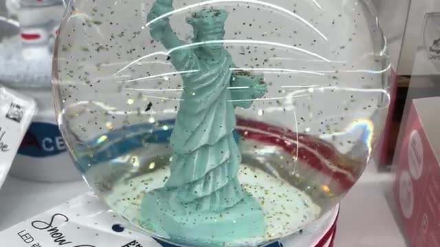 a glass ball containing the Statue of Liberty