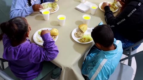 After perilous trek, migrants get Thanksgiving meal on US border