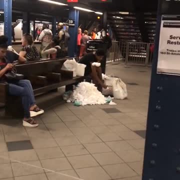 Woman subway station wasting tissue mountain wiping feet