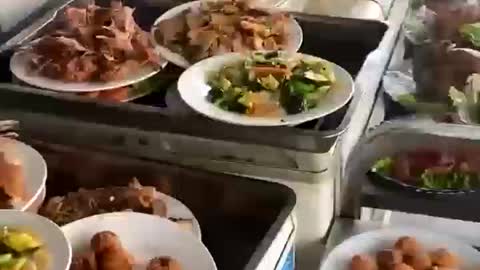 The restaurant chef is busy with the dishes of the wedding banquet