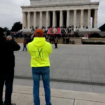 Lincoln memorial crowd . Who do they work for?