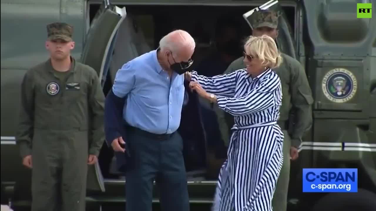 Biden struggles to put his jacket on