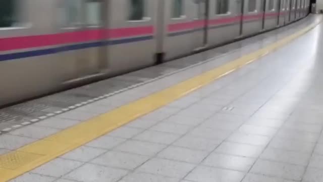 Subway arriving at a station in Japan