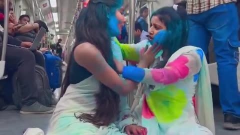 Holi in metro ! Girl play with Gulal !