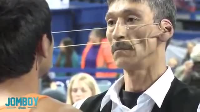 Guy wins the 2012 Ear Pulling contest CRAZYYYY