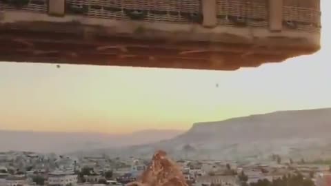 Omg, she's delivering fruit to a hot air balloon?