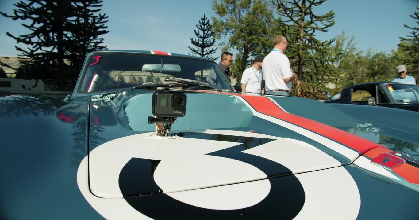 A Racing Car On Display Outdoors In A Car Show