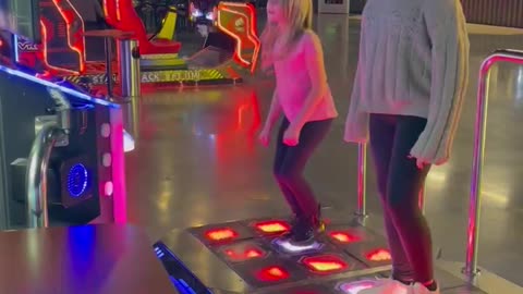 Sisters duel at Dance Dance Revolution