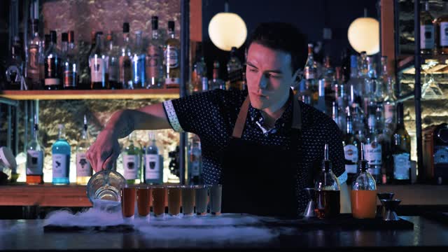 Bartender preparing shots