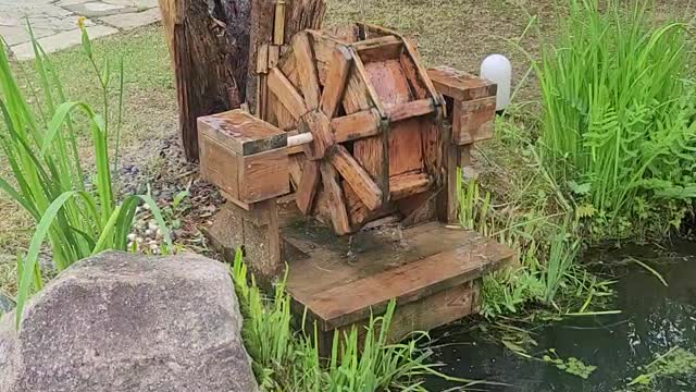 Pond sculpture waterwheel