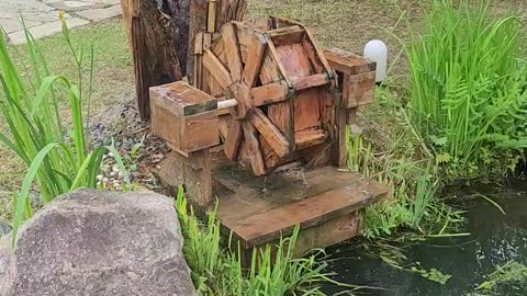 Pond sculpture waterwheel