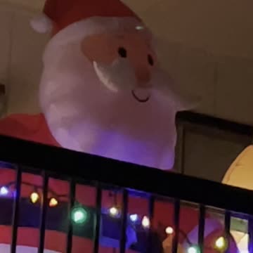 Santa Clause looking from balcony
