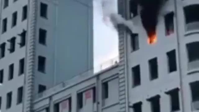 Drone putting out fire in building