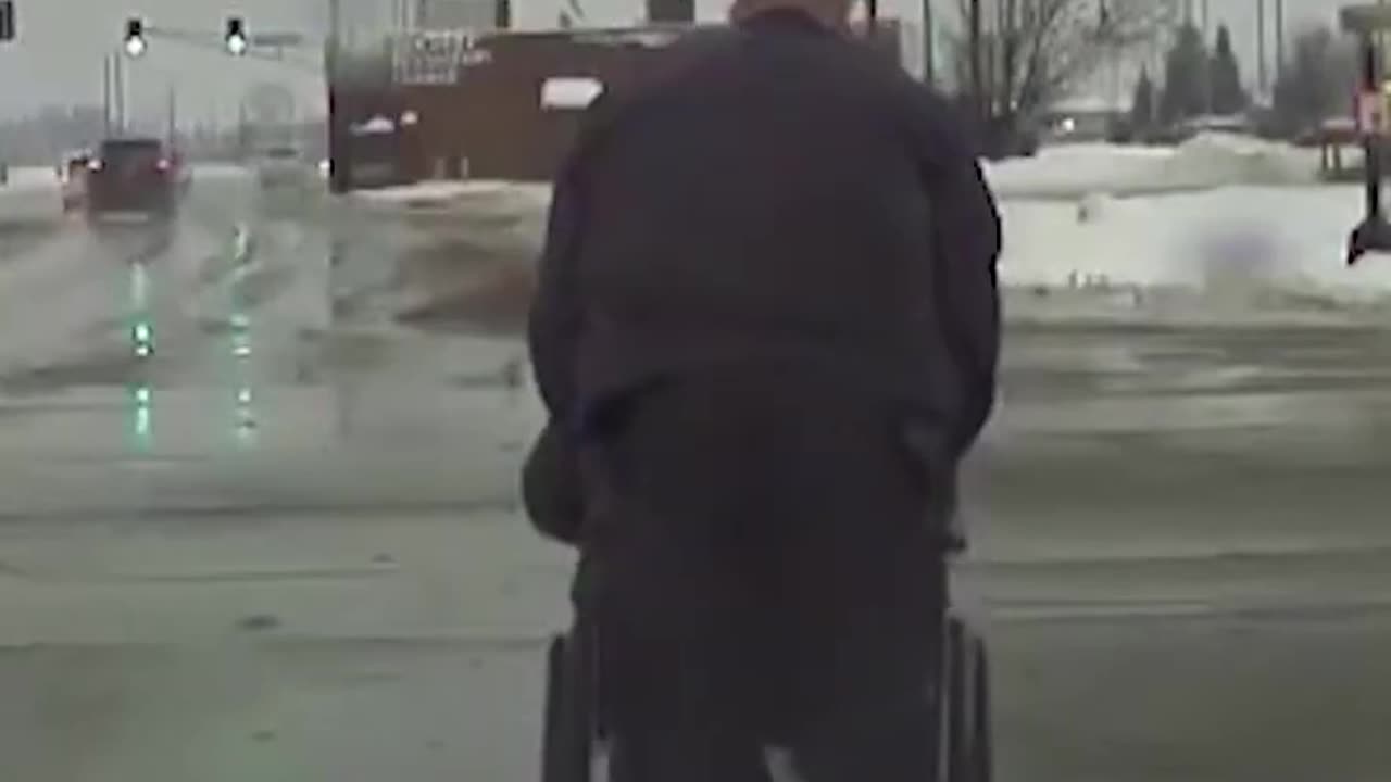 Heartwarming video shows moment Indiana officer helps wheelchair user cross busy intersection