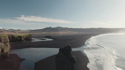 Waves breaking on a volcanic beach