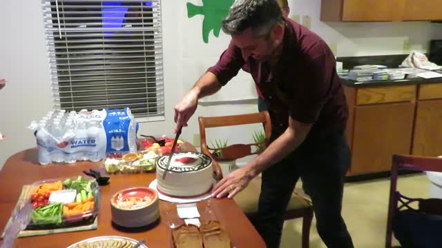 Chaim Malespin - cutting the Aliyah Return Center cake