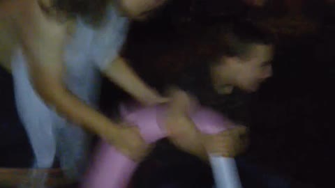 Guy getting pushed on cart and falling down