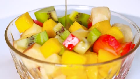Rotating bowl with fruit on a white background