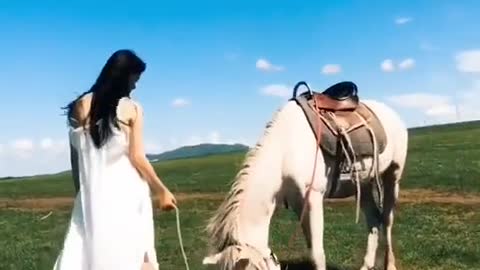 A beautiful girl with a horse