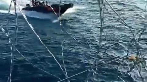 SHIP PREPARING TO PASS THROUGH PIRATE AREA
