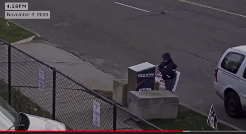 US Postal worker visiting the same drop box with stacks of ballots.