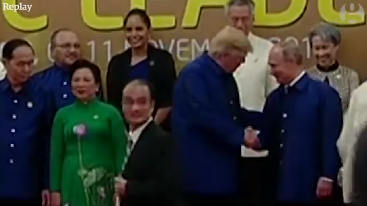 Donald Trump and Vladimir Putin shake hands at Apec