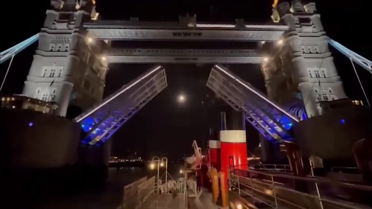 The Waverley paddle steamer passes under London's Tower Bridge before heading back to Glasgow