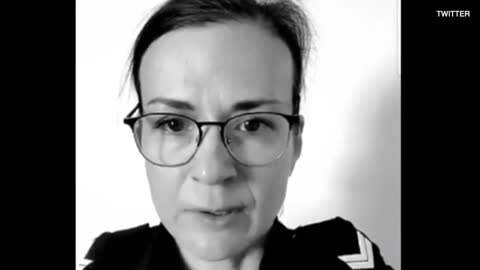 Police Officer stands behind truckers
