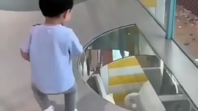 Toddler afraid to cross from glass bridge😅