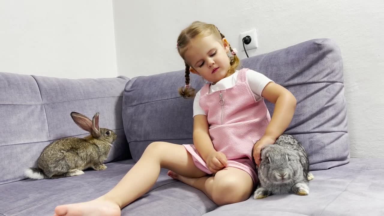 Adorable Baby Girl Meets New Rabbits for the First Time & Wonders Why They Have Such Big Ears!