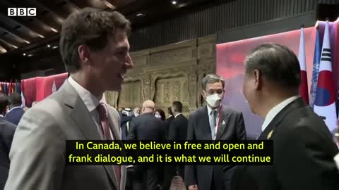 China and Canada leaders caught having tense exchange on camera - BBC News