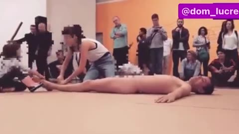 Artist Wagner Schwartz encouraged this 4-year-old girl to interact with his naked body.