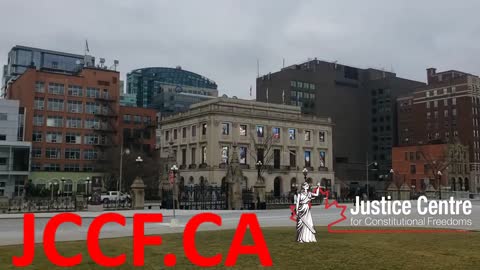 John Carpay addresses supporters from outside parliament in Ottawa.