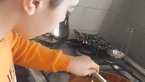 My son cooking