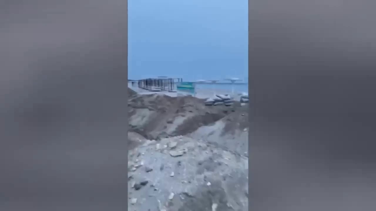 Russians preparing to defend themselves by digging trenches on a sea coast