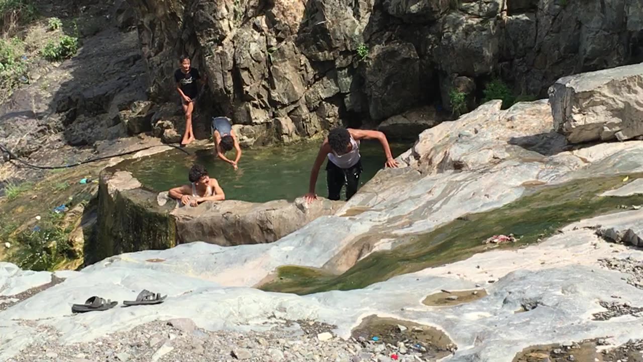 My children are having fun in the mountain pool