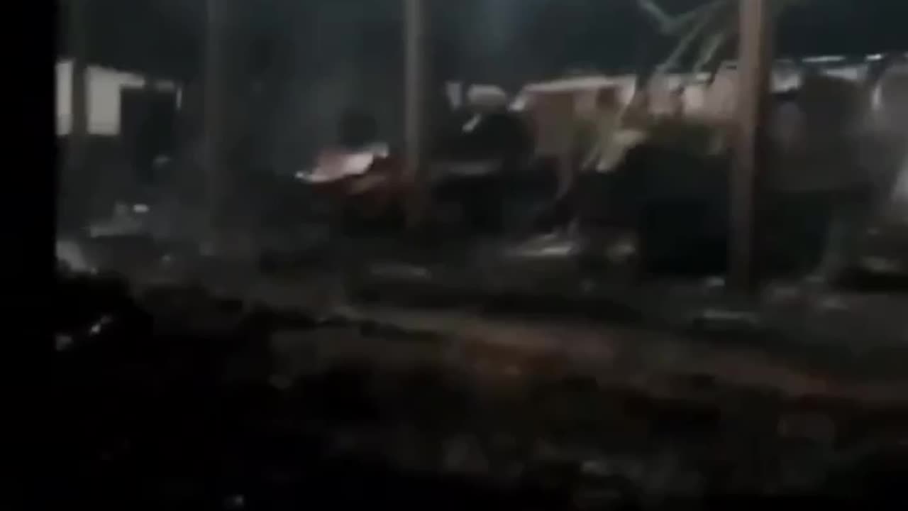 Russian Soldiers Filim the Aftermath of a HIMARs Strike on a Vehicle Depot