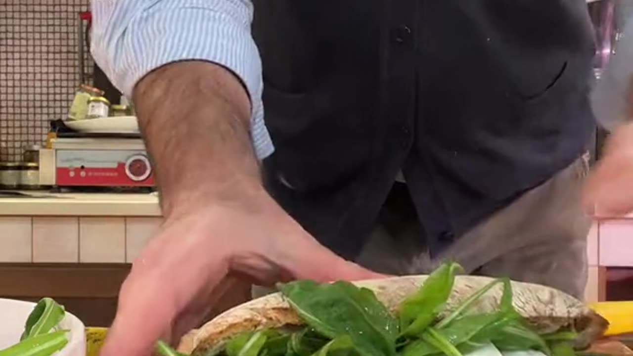 Making fresh Italian sandwich