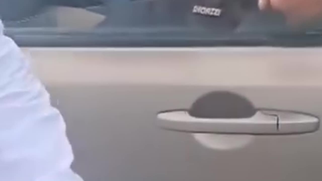A man in police uniform looting the passengers
