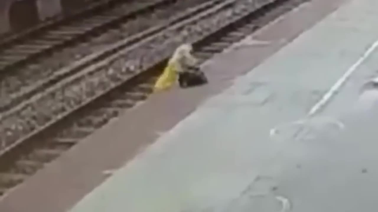 Woman Cross Railwy Track in India