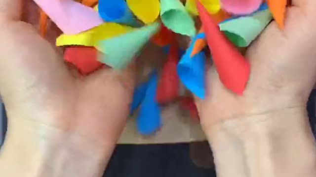 A small square piece of paper can be used to make a three-dimensional color hedgehog