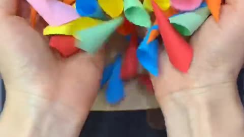 A small square piece of paper can be used to make a three-dimensional color hedgehog