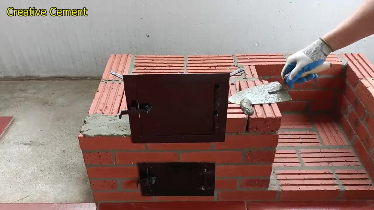 Outdoor wood stove from red brick and cement