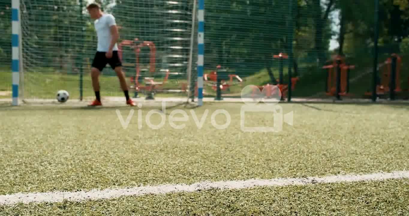 Close Up Of Soccer Player's Legs Executing Penalty Kick And Scoring A Goal