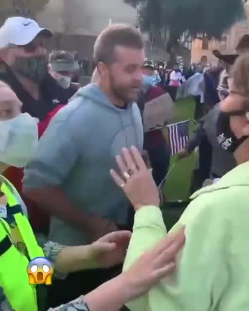 Covid cult members surround and assault man stop wear masks outside.