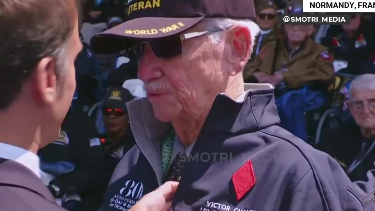 Biden greeted a veteran by touching his face with his fist at the D-Day anniversary.